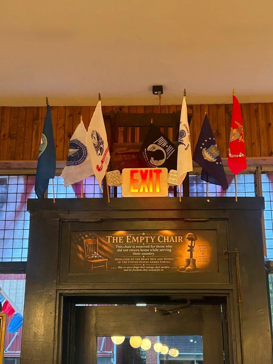 The Empty Chair memorial sign at J. Marie's
